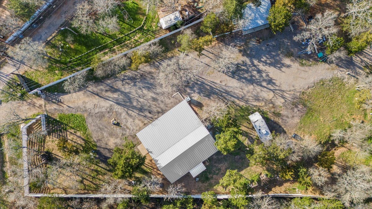 240 Riddle Road Cedar Creek, TX 78612 - Photo 28 of 31 a view of a house with a yard