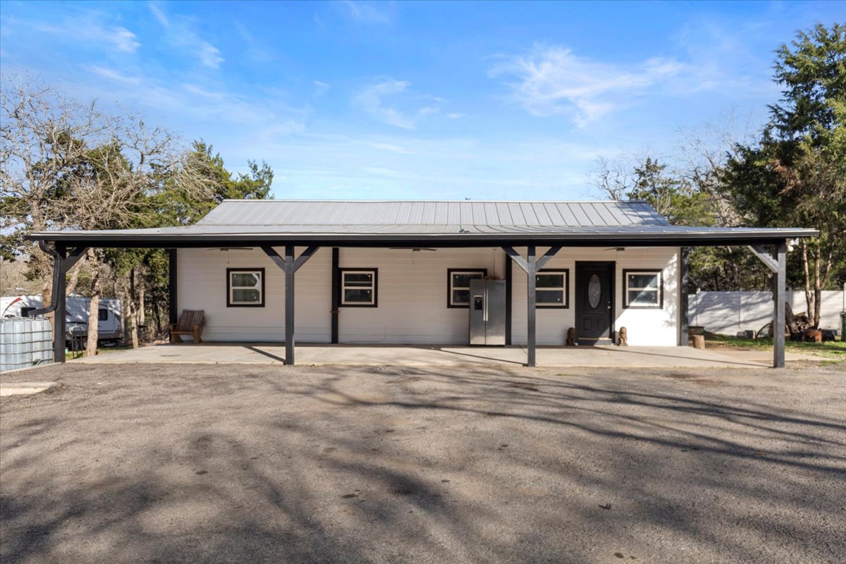 240 Riddle Road Cedar Creek, TX 78612 - Photo 3 of 31 a front view of a house with a porch