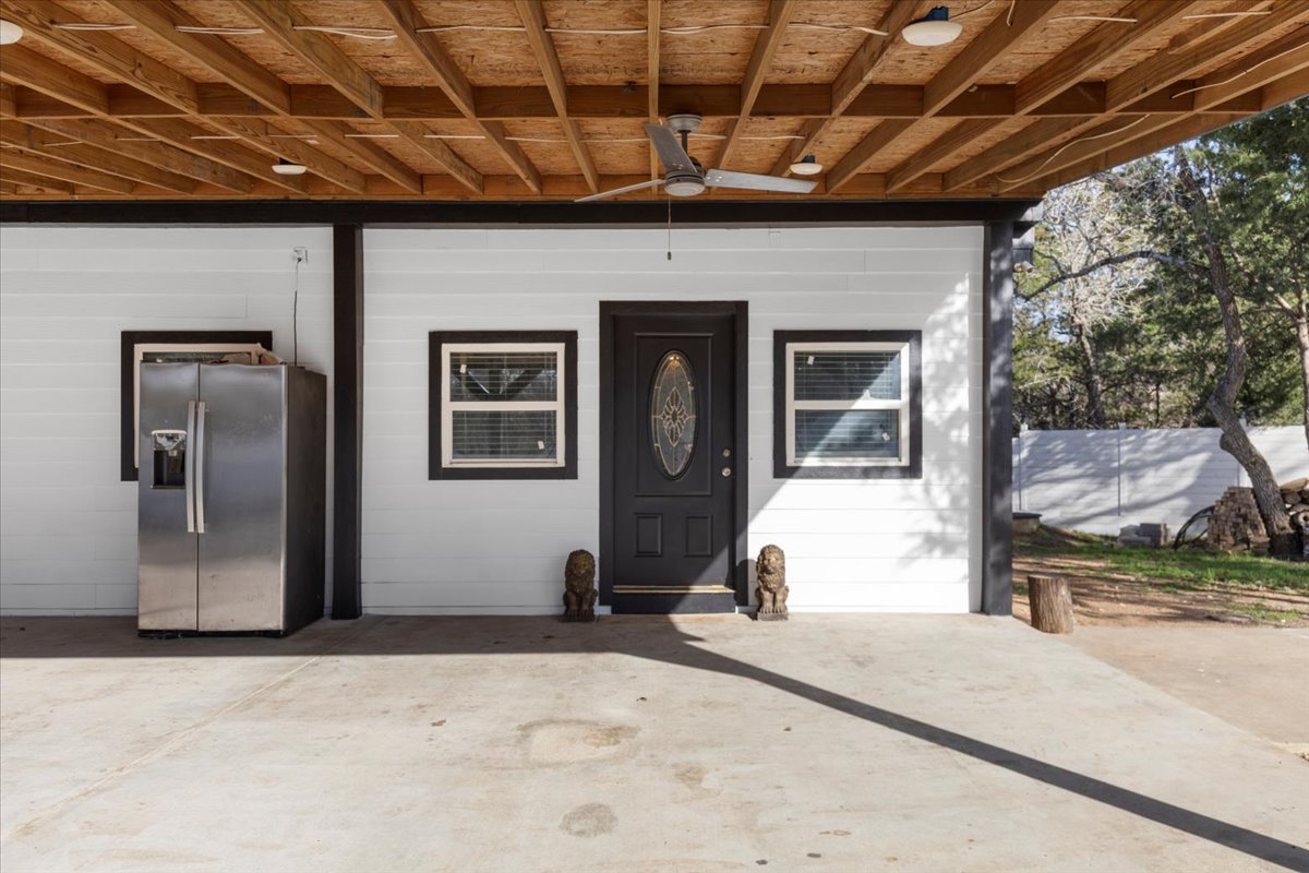 240 Riddle Road Cedar Creek, TX 78612 - Photo 6 of 31 a front view of a house with a yard