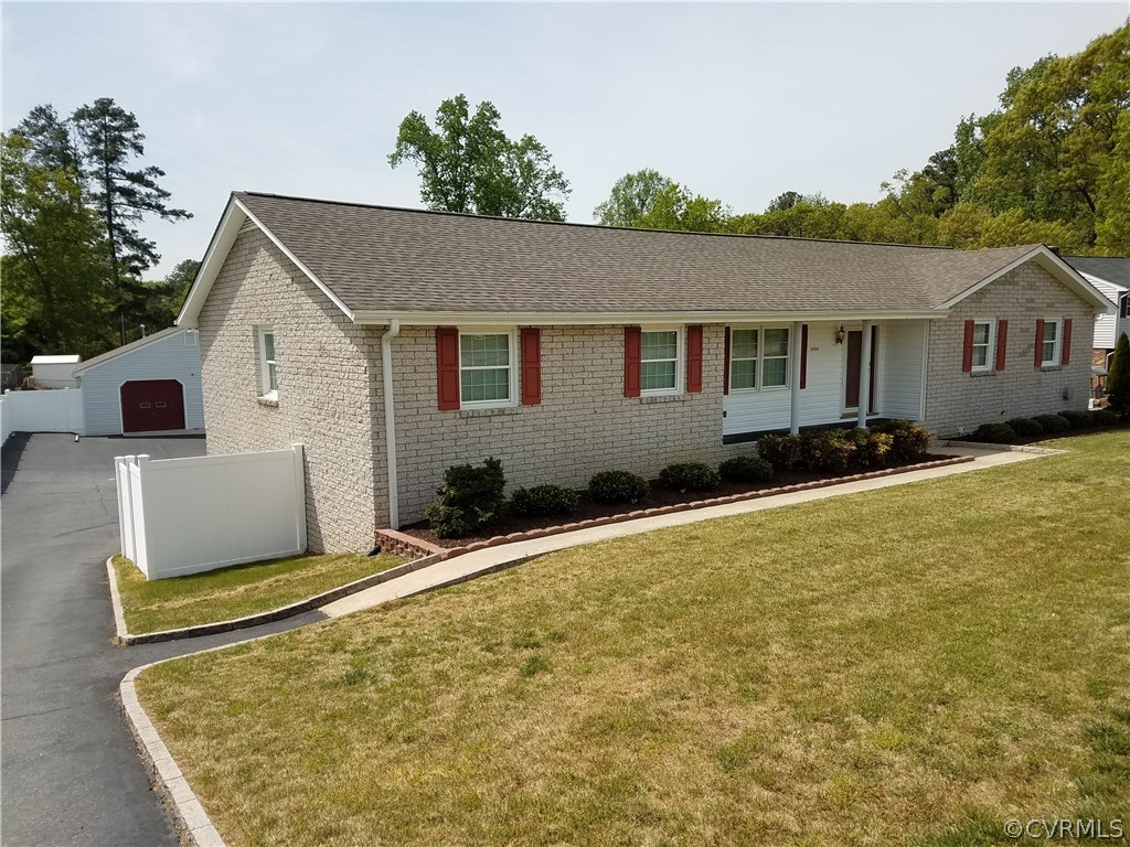 13104 South Chester Road Chester, VA 23831 - Photo 1 of 28 a backyard of a house with wooden floor and large trees