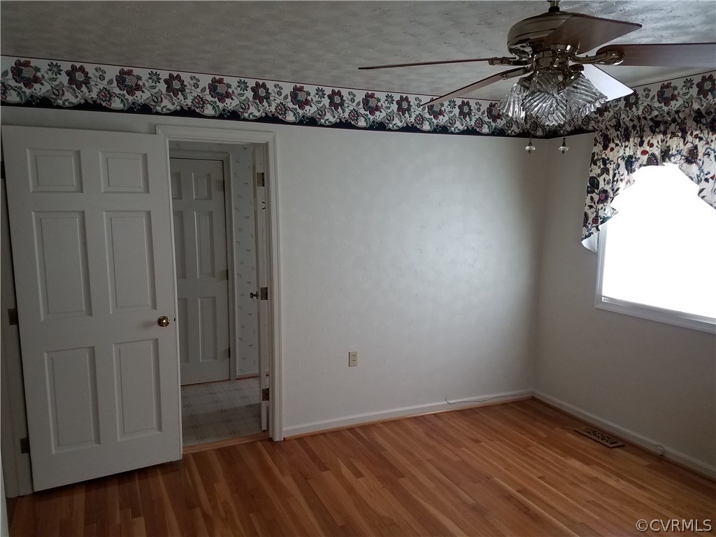 13104 South Chester Road Chester, VA 23831 - Photo 13 of 28 a view of a room with rack and wooden floor