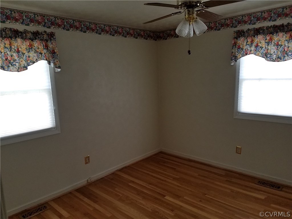 13104 South Chester Road Chester, VA 23831 - Photo 14 of 28 a view of a room with wooden floor and window