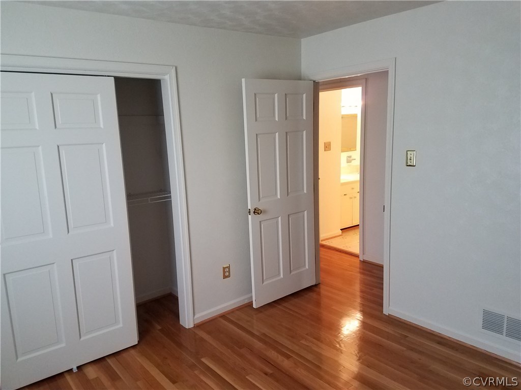 13104 South Chester Road Chester, VA 23831 - Photo 15 of 28 a view of a hallway with wooden floor