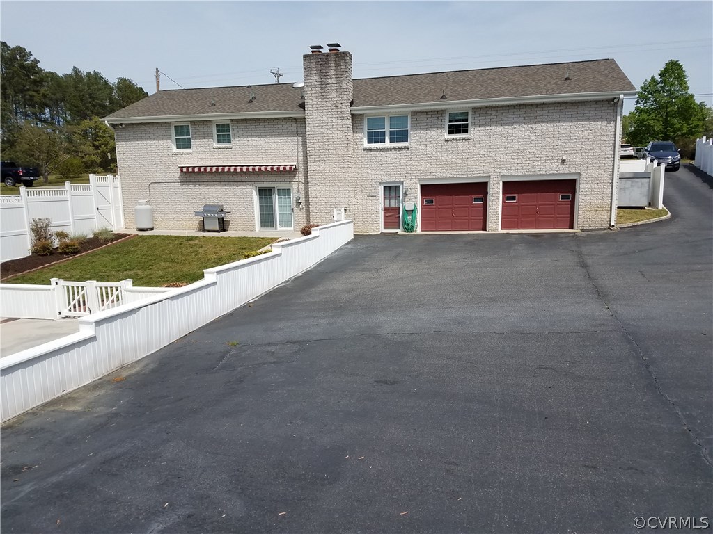 13104 South Chester Road Chester, VA 23831 - Photo 2 of 28 a view of house with outdoor space and parking
