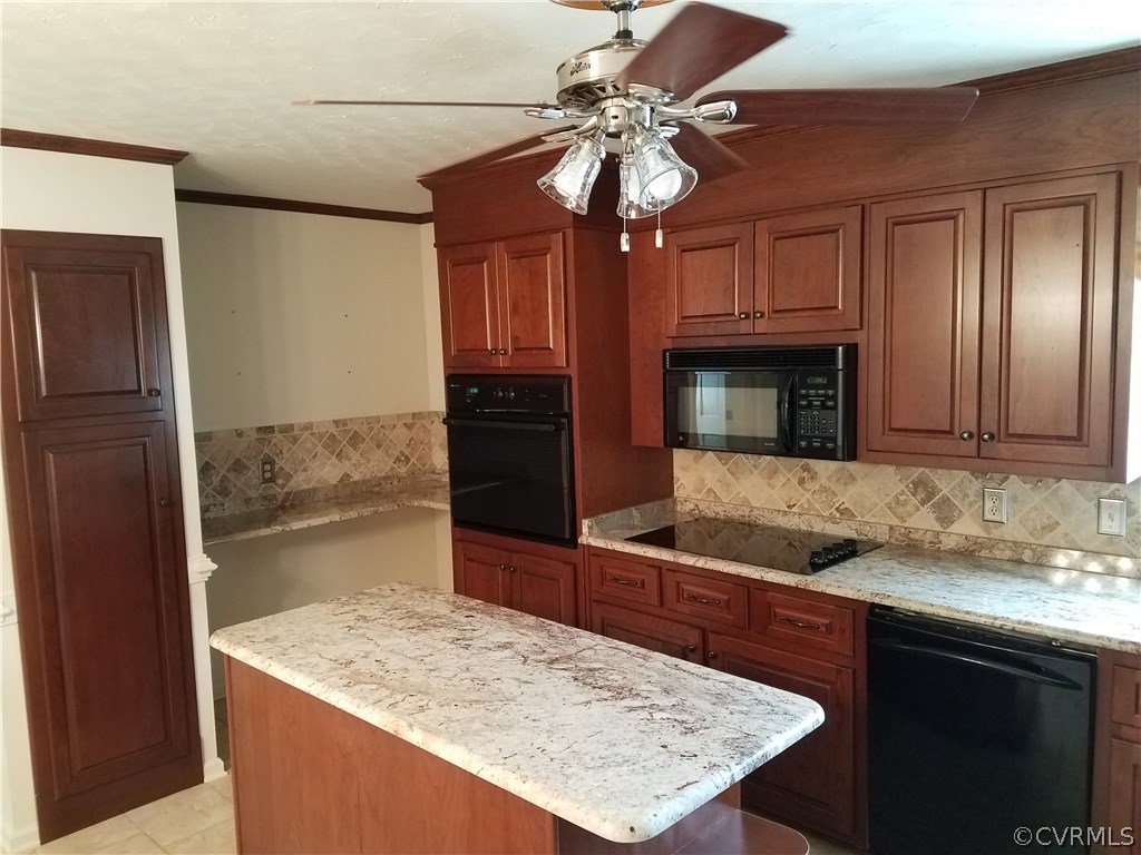 13104 South Chester Road Chester, VA 23831 - Photo 3 of 28 a kitchen with kitchen island granite countertop a sink and refrigerator