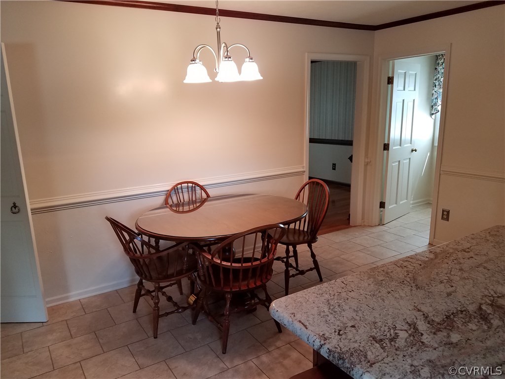 13104 South Chester Road Chester, VA 23831 - Photo 5 of 28 a view of a dining room with furniture and chandelier