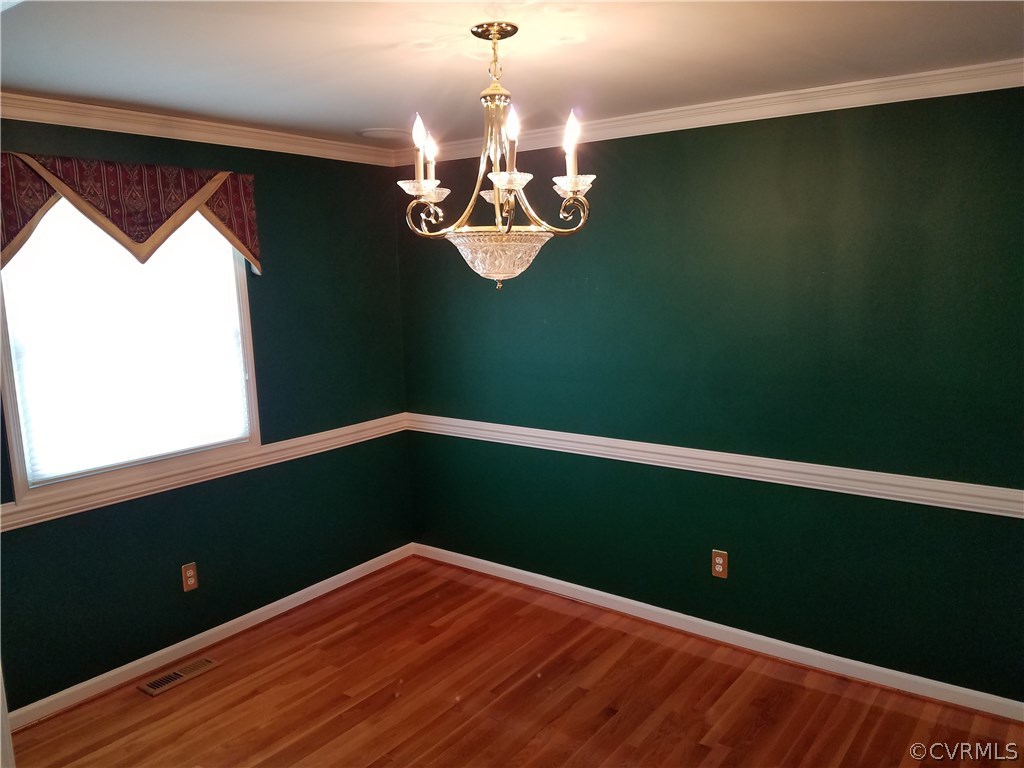 13104 South Chester Road Chester, VA 23831 - Photo 8 of 28 a view of a room with wooden floor and fan