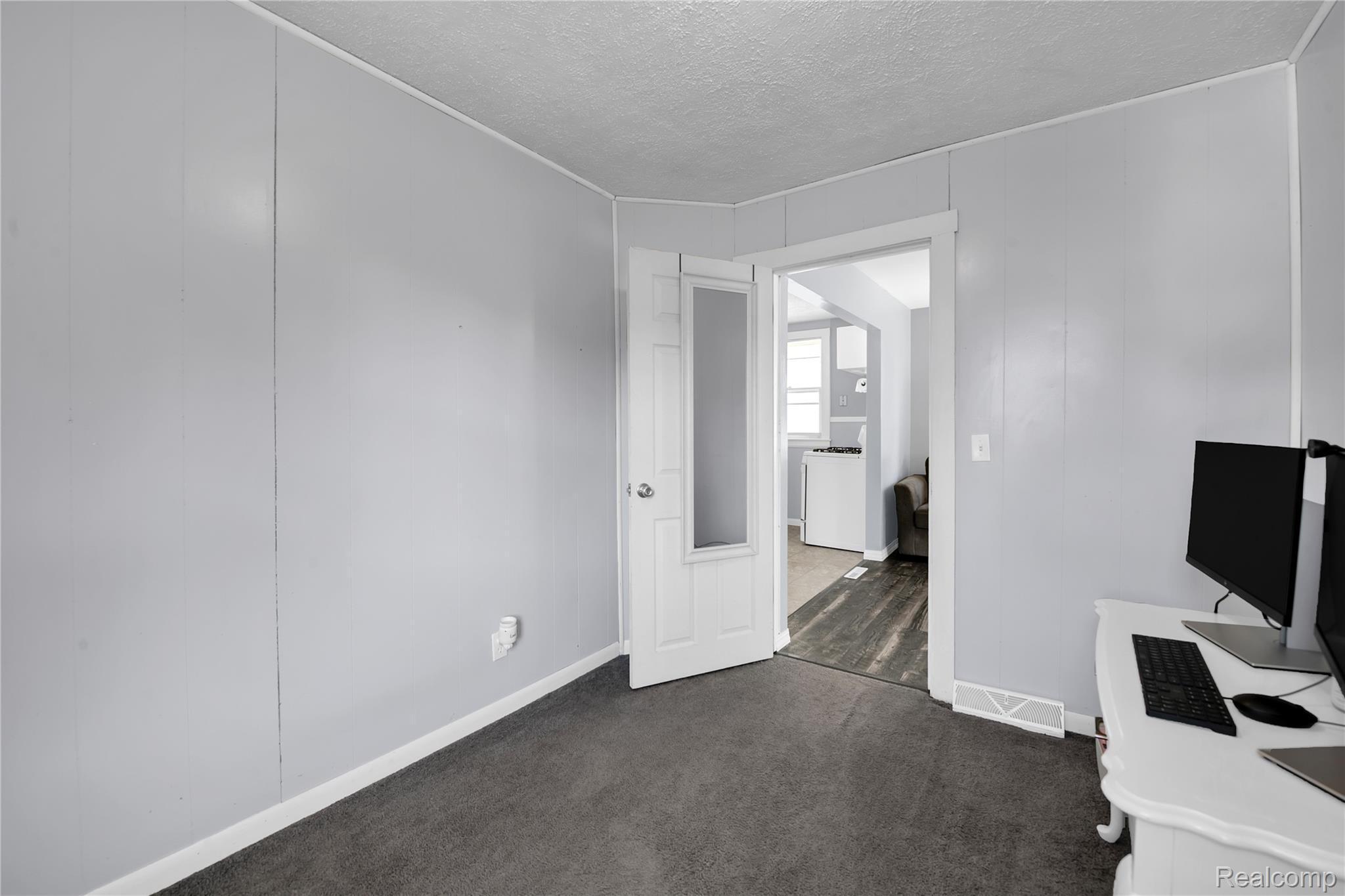 58925 Haven Ridge Road New Haven, MI 48048 - Photo 12 of 22 Unfurnished office with a textured ceiling and dark carpet
