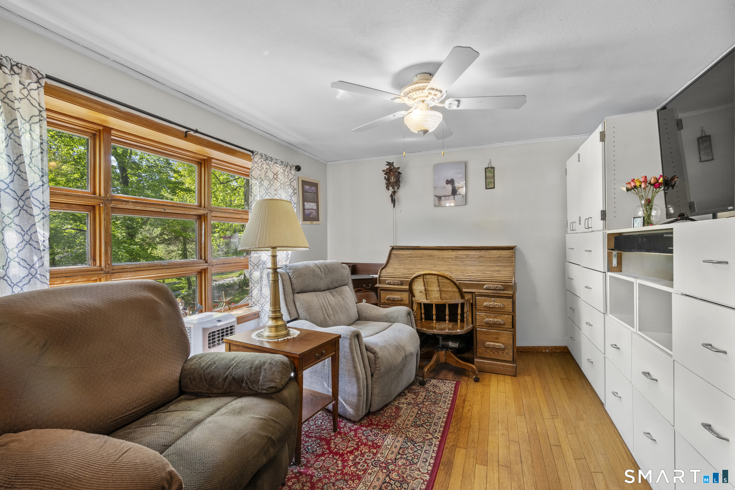 121 River Road Preston, CT 06365 - Photo 14 of 37 a living room with furniture and a floor to ceiling window