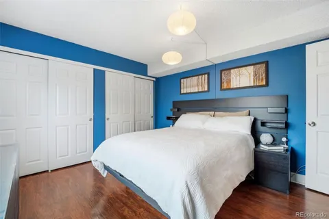 a bedroom with a bed and a closet