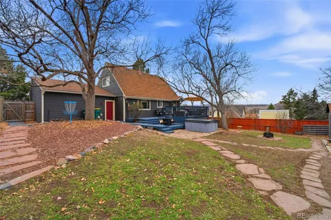a view of house with a yard
