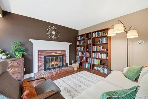 a view of a livingroom with furniture and a fireplace