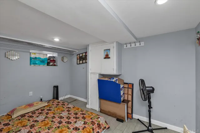 a bedroom with a bed and a chair