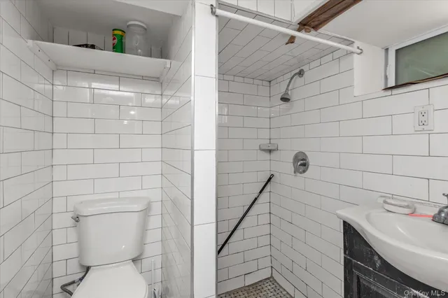 a bathroom with a sink and toilet