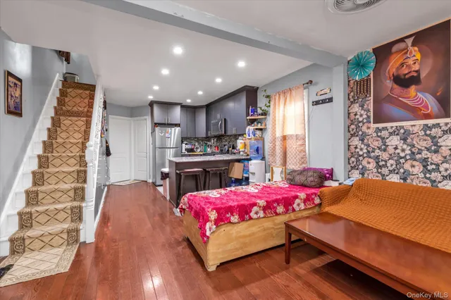 a bedroom with a bed and a couch