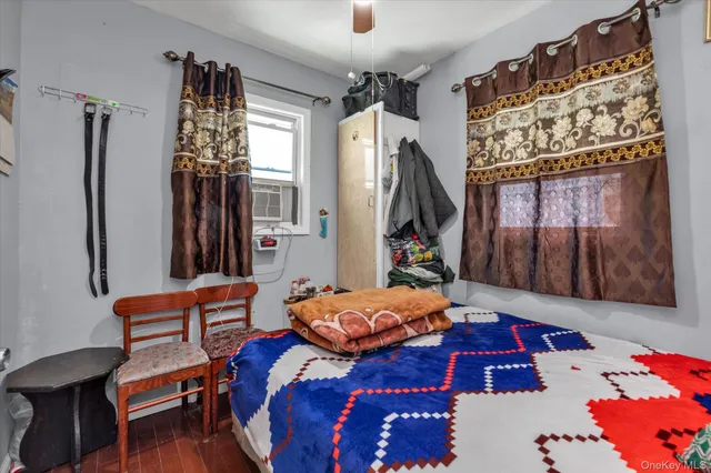 a bedroom with furniture and a window