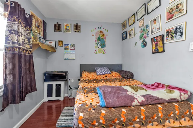 a bedroom with a bed and a desk