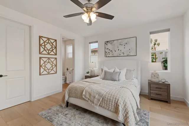 a bedroom with a bed and a view of room