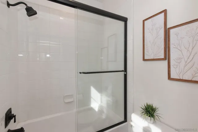 a bathroom with a bathtub and a shower