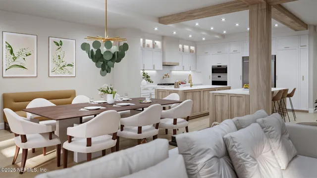 a living room with furniture a kitchen view and a chandelier
