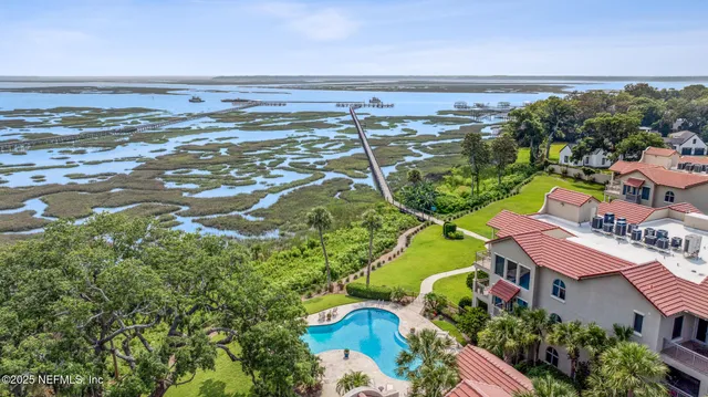 a bedroom with a bed and lamp