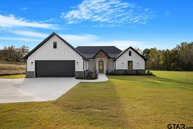 a view of a house with pool and yard