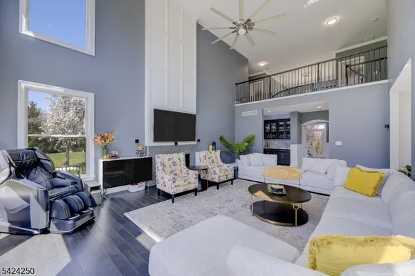 a living room with furniture fireplace and a window