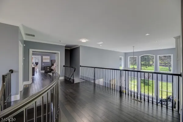a view of a living room and wooden floor