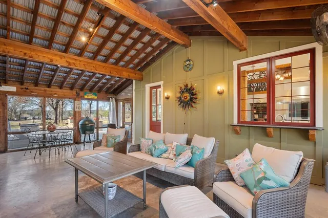 a view of a house with a yard balcony and sitting area