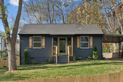 front view of a house with a yard
