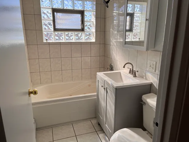 a bathroom with a sink and a bathtub