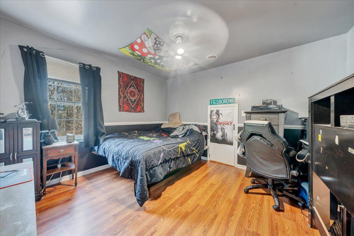 65 Avon Street Rocky Mount, VA 24151 - Photo 14 of 46 a bedroom with a bed and furniture