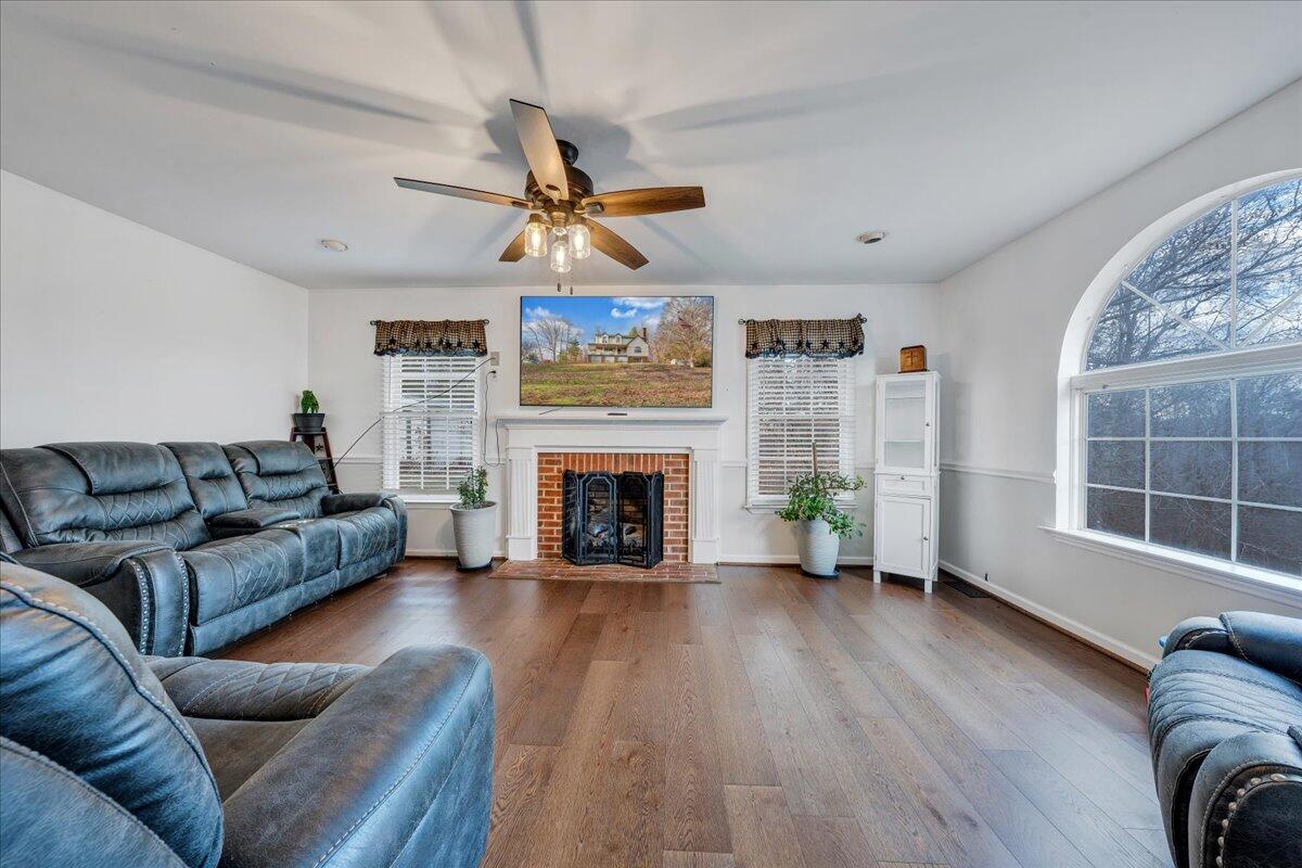 65 Avon Street Rocky Mount, VA 24151 - Photo 3 of 46 a living room with furniture a fireplace and a large window