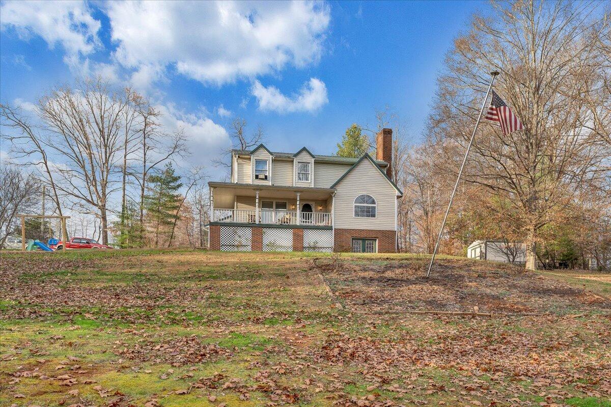 65 Avon Street Rocky Mount, VA 24151 - Photo 32 of 46 a view of a large house with a big yard and large tree