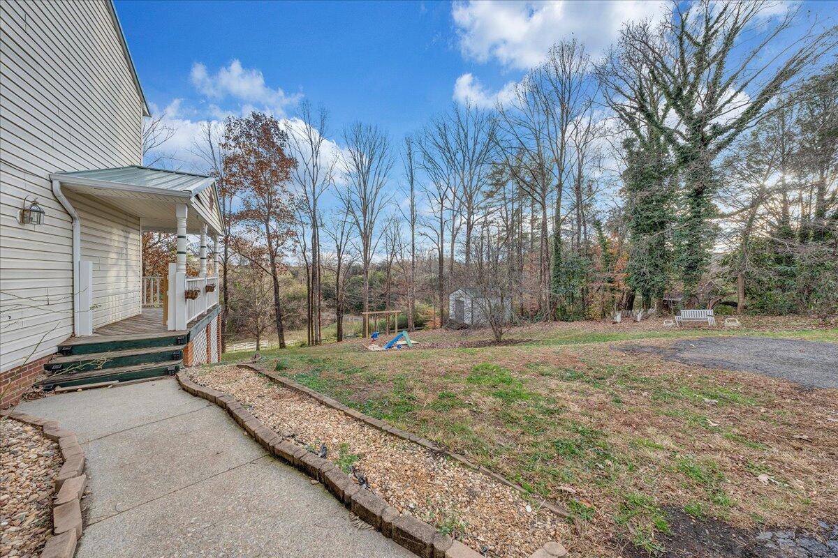 65 Avon Street Rocky Mount, VA 24151 - Photo 37 of 46 a view of a backyard with large trees