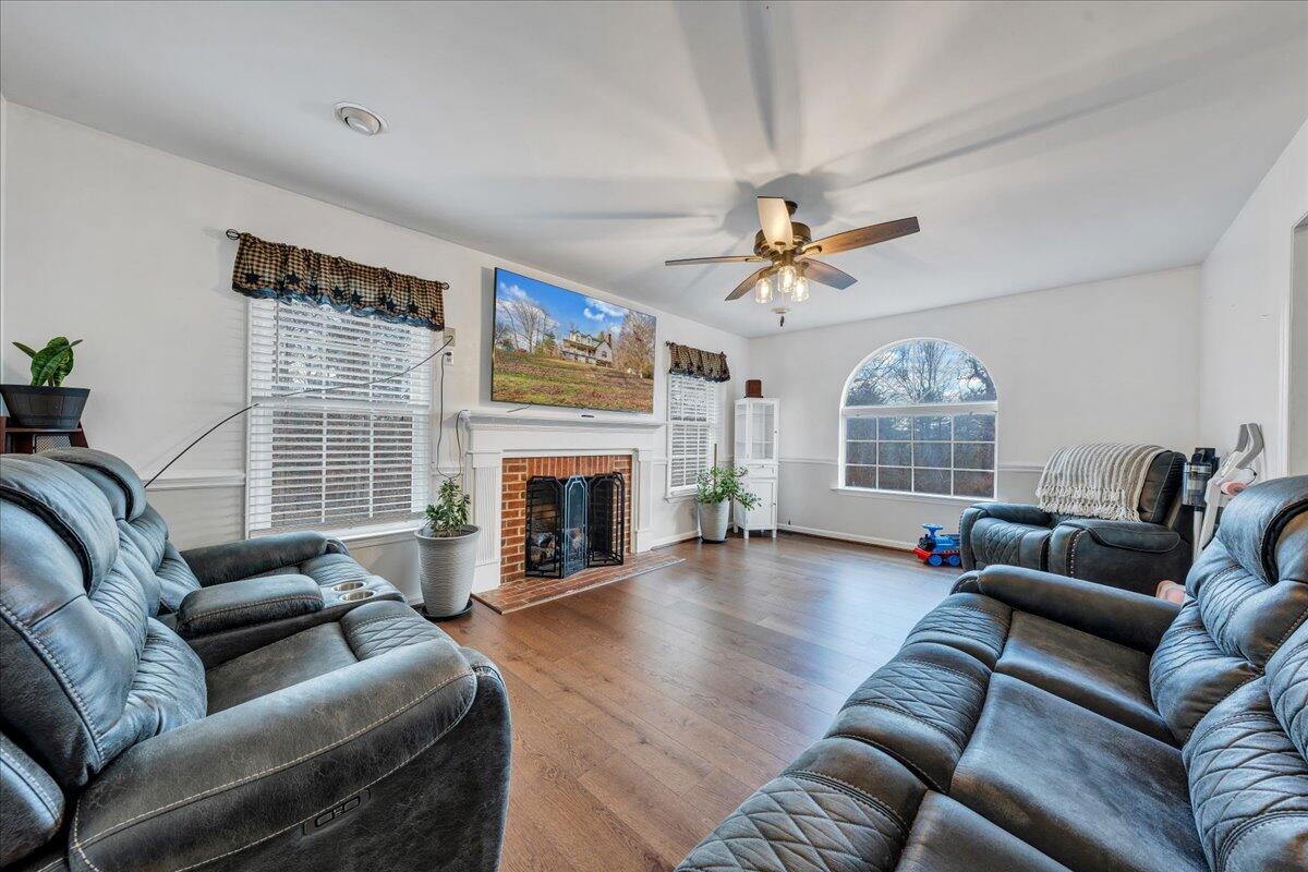 65 Avon Street Rocky Mount, VA 24151 - Photo 4 of 46 a living room with furniture a fireplace and a large window