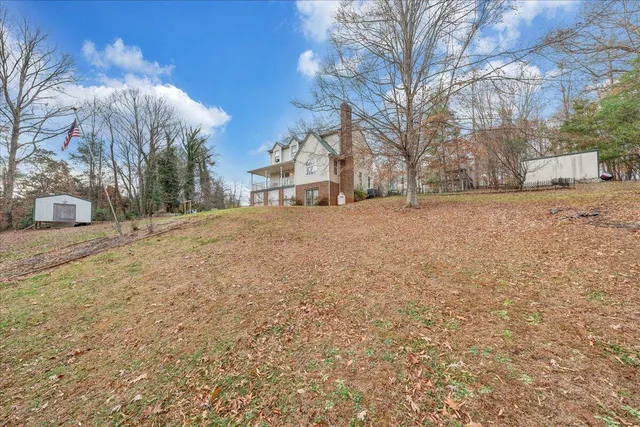 a view of a house with a snow in the yard