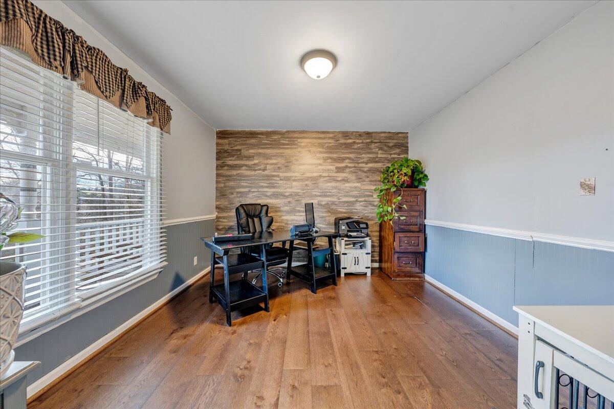 65 Avon Street Rocky Mount, VA 24151 - Photo 5 of 46 a view of a workspace with furniture and a window