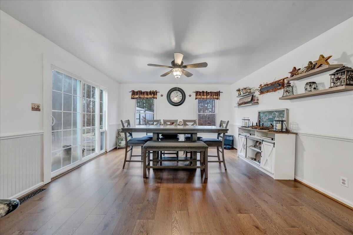 65 Avon Street Rocky Mount, VA 24151 - Photo 10 of 46 a living room with stainless steel appliances granite countertop furniture wooden floor and a fireplace