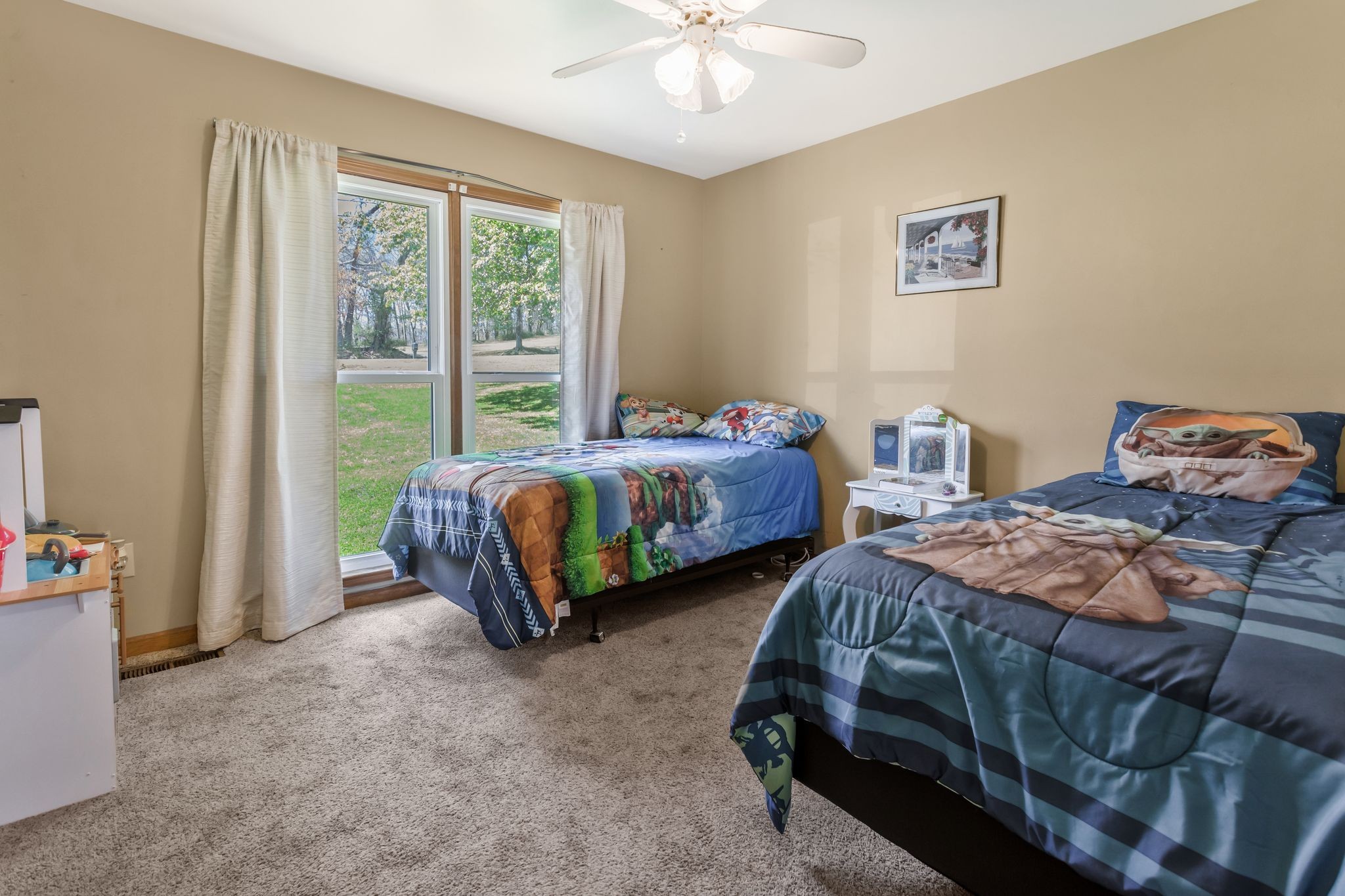 1006 Rip Steele Road Columbia, TN 38401 - Photo 15 of 26 a bedroom with two beds and a chandelier