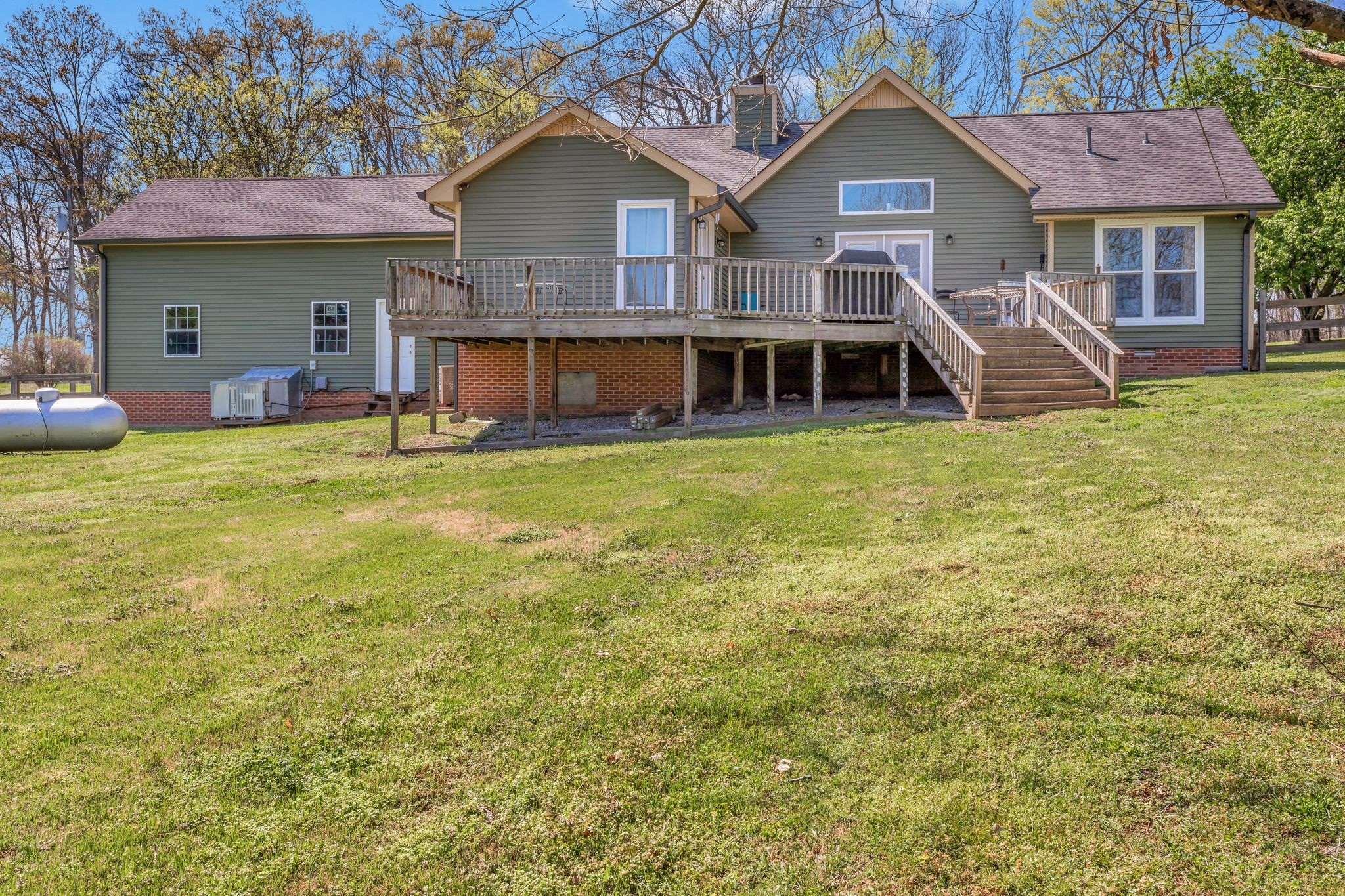 1006 Rip Steele Road Columbia, TN 38401 - Photo 20 of 26 a front view of a house with a yard and garage