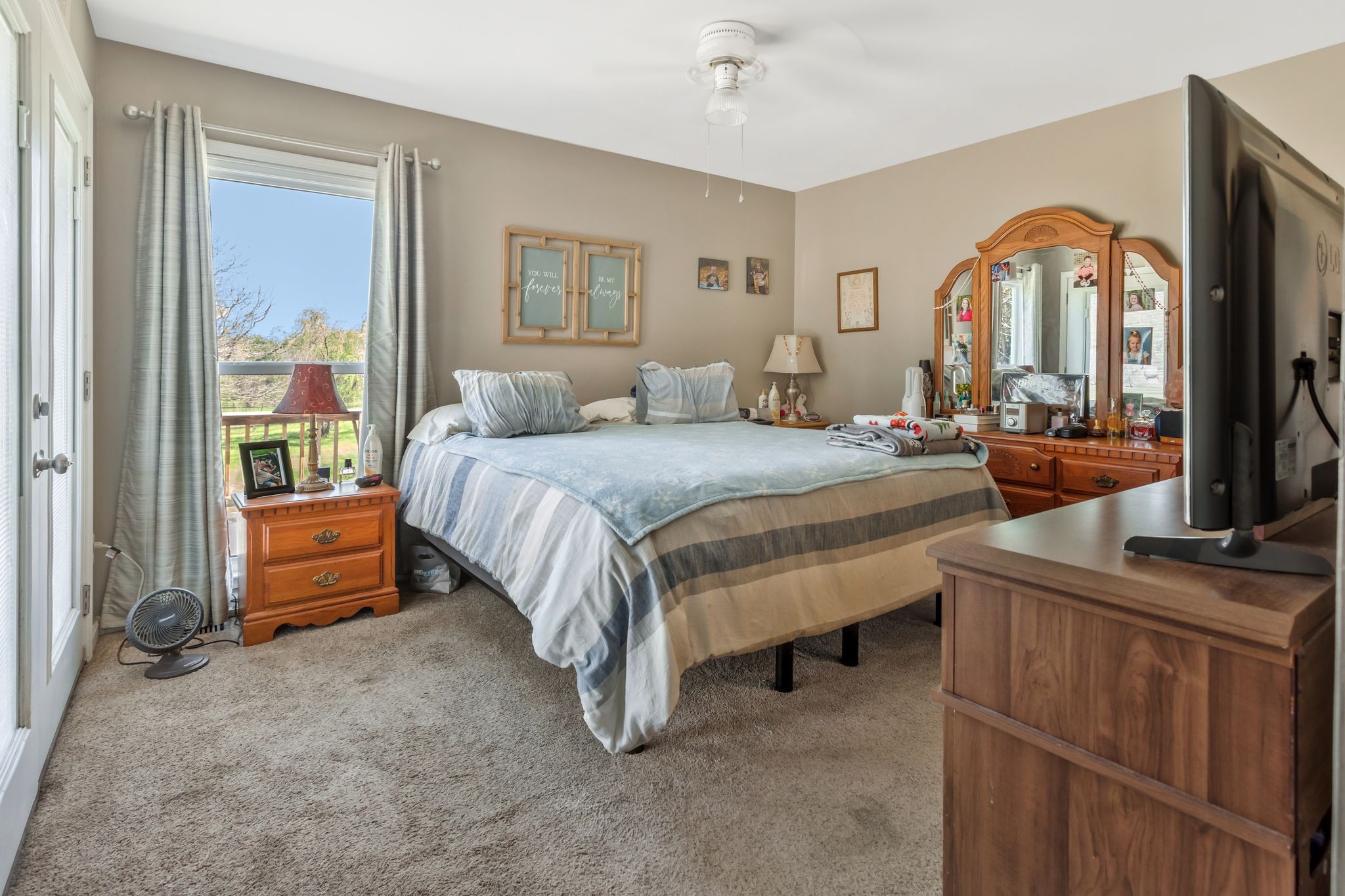 1006 Rip Steele Road Columbia, TN 38401 - Photo 10 of 26 a bedroom with a bed and a dresser