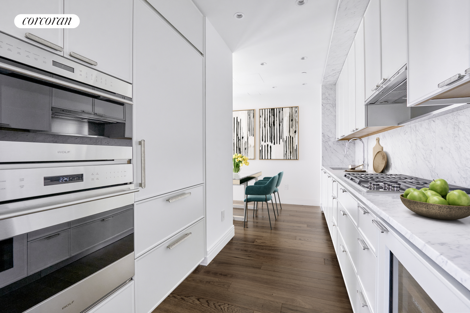430 East 58th Street, Unit 16B Manhattan, NY 10022 - Photo 2 of 19 a kitchen with stove cabinets and wooden floor