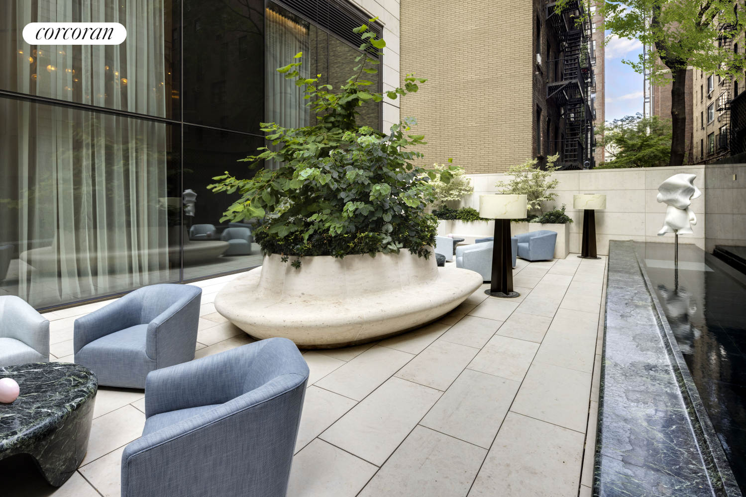 430 East 58th Street, Unit 16B Manhattan, NY 10022 - Photo 8 of 19 a view of a patio with couches and potted plants