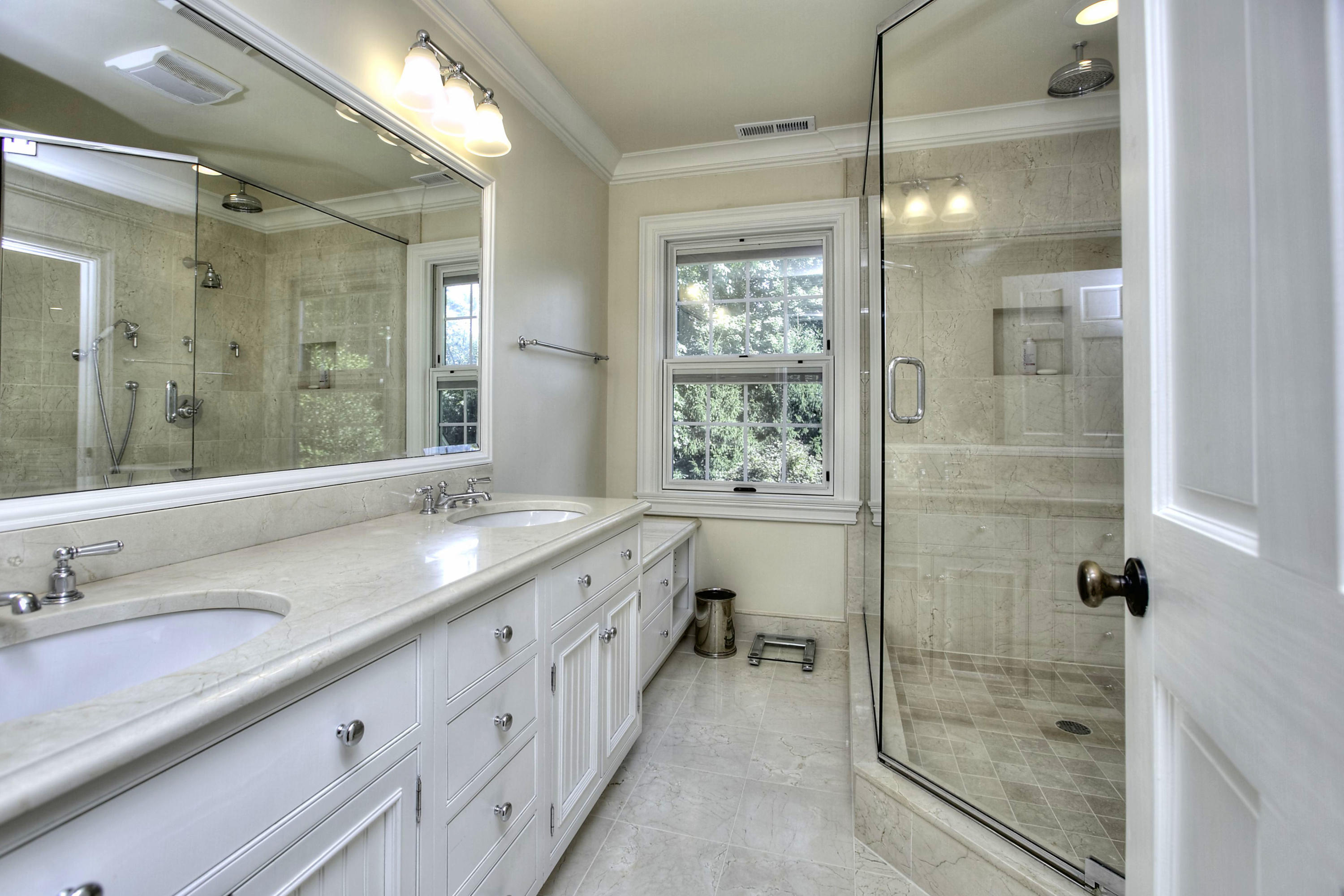 176 Marshall Ridge Road New Canaan, CT 06840 - Photo 12 of 29 a bathroom with a shower sink and mirror