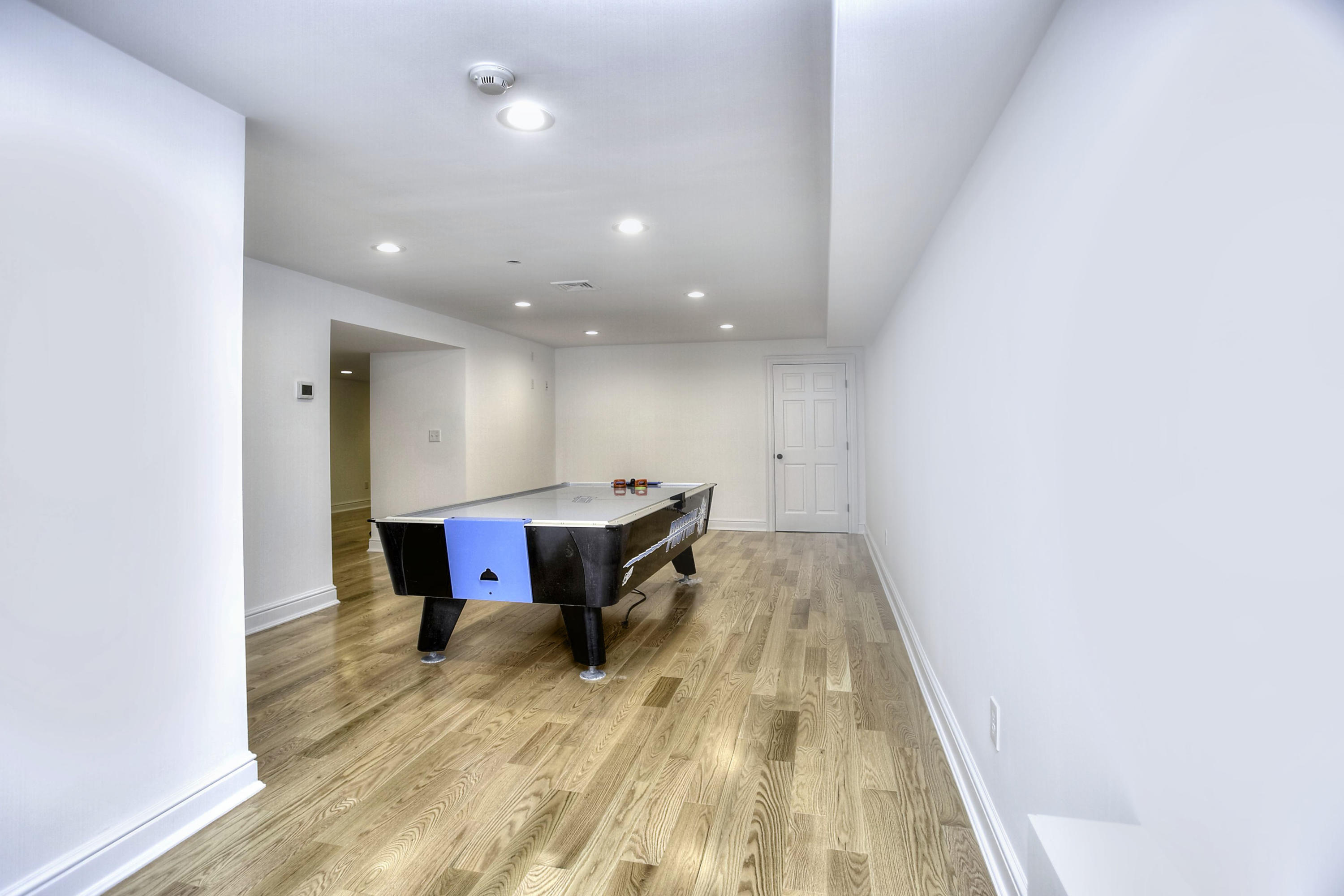 176 Marshall Ridge Road New Canaan, CT 06840 - Photo 18 of 29 a view of a room with wooden floor and furniture