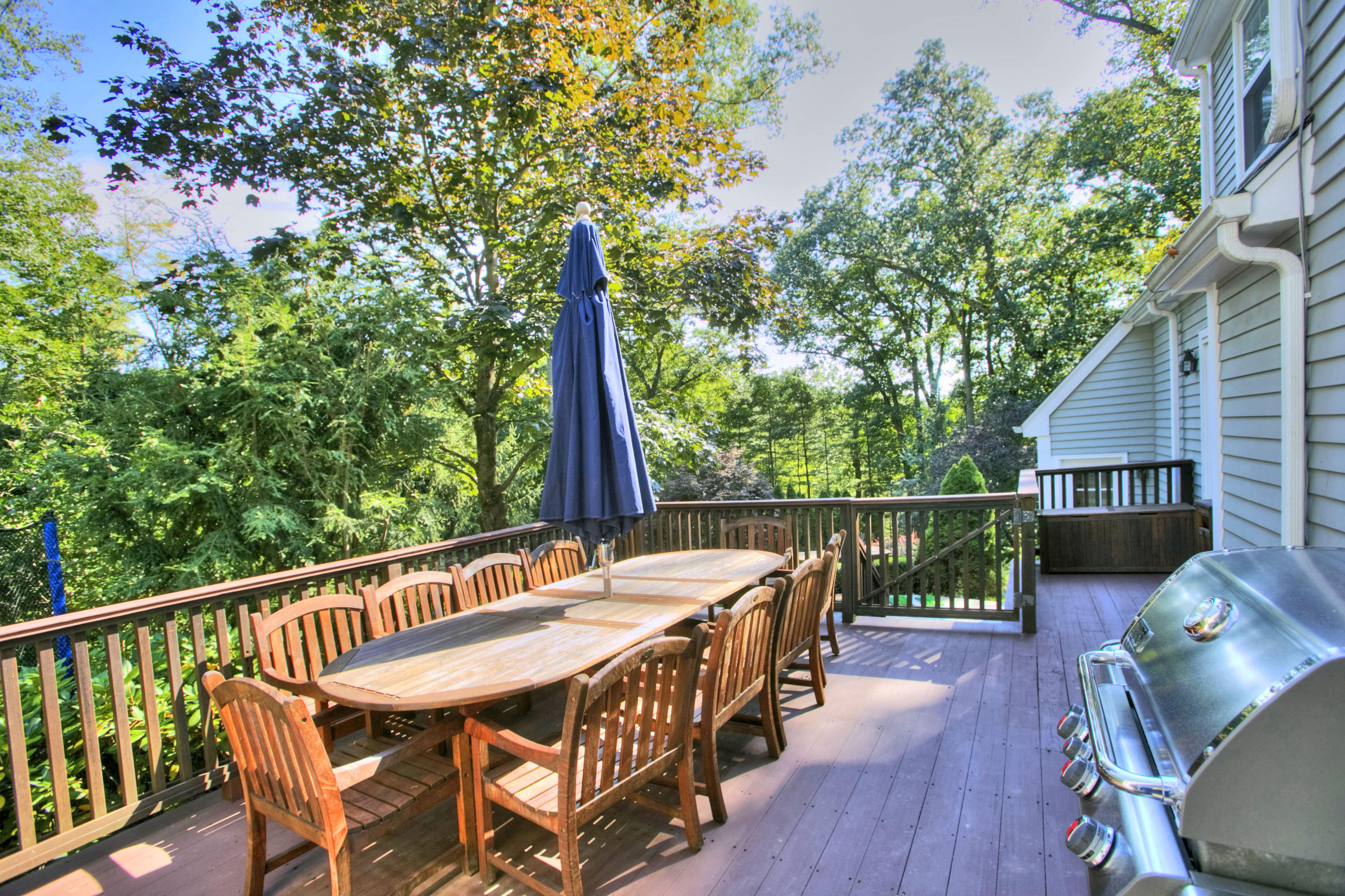 176 Marshall Ridge Road New Canaan, CT 06840 - Photo 19 of 29 a balcony with wooden floor table and chairs
