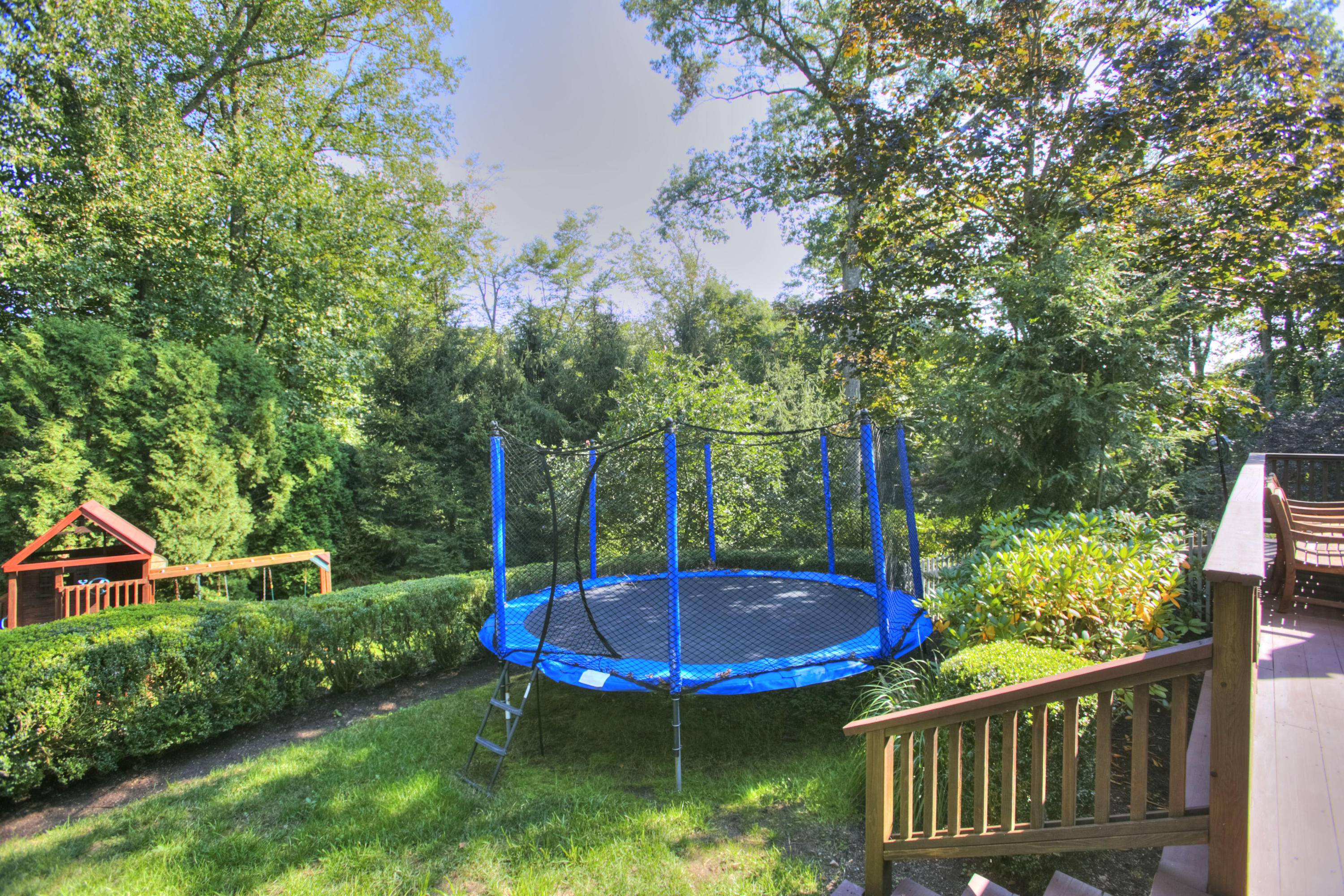176 Marshall Ridge Road New Canaan, CT 06840 - Photo 23 of 29 a view of a chair and table in the garden