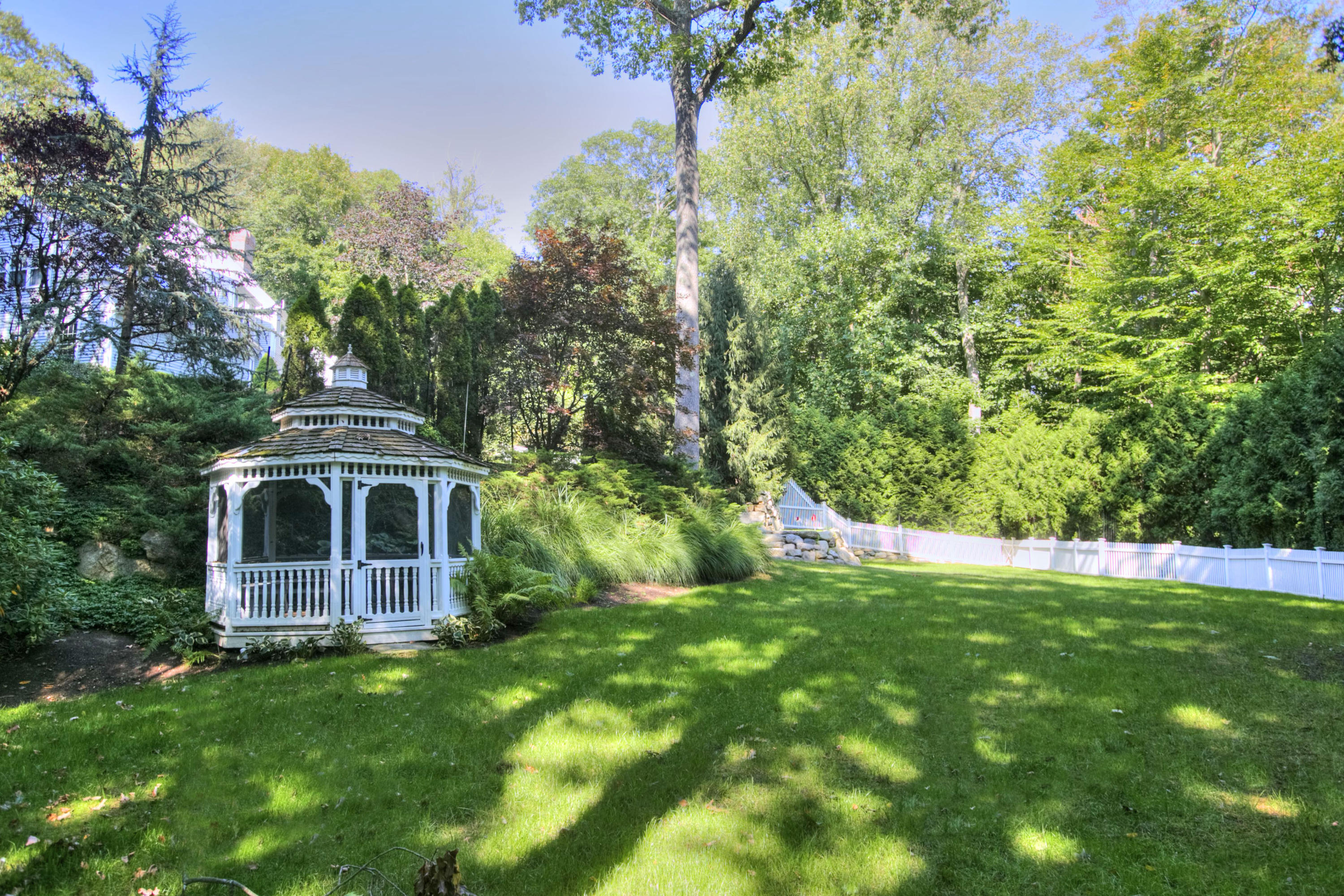 176 Marshall Ridge Road New Canaan, CT 06840 - Photo 28 of 29 a front view of a house with a garden