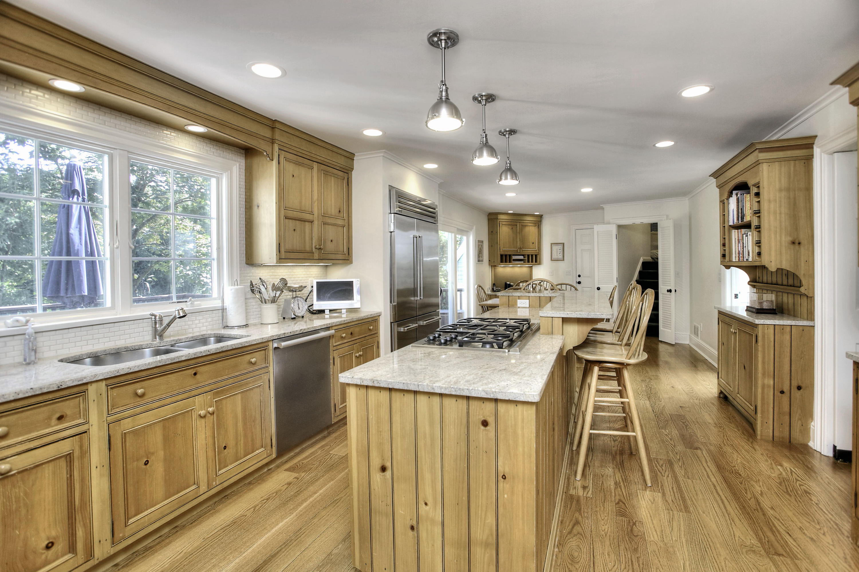 176 Marshall Ridge Road New Canaan, CT 06840 - Photo 4 of 29 a large kitchen with kitchen island a large island in it